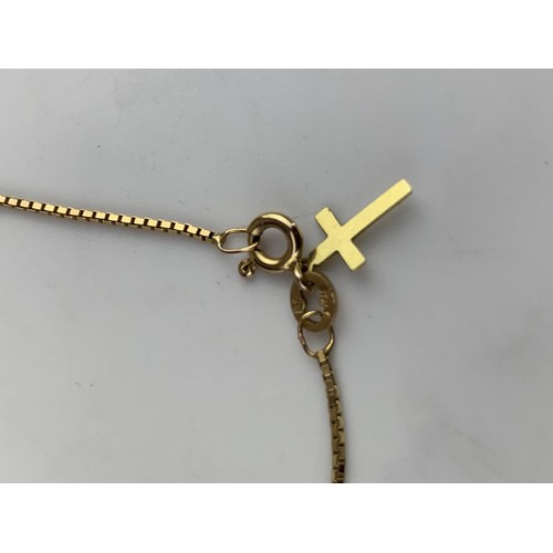 587 - A 9ct GOLD WRIST CHAIN SET WITH 9ct GOLD CROSS