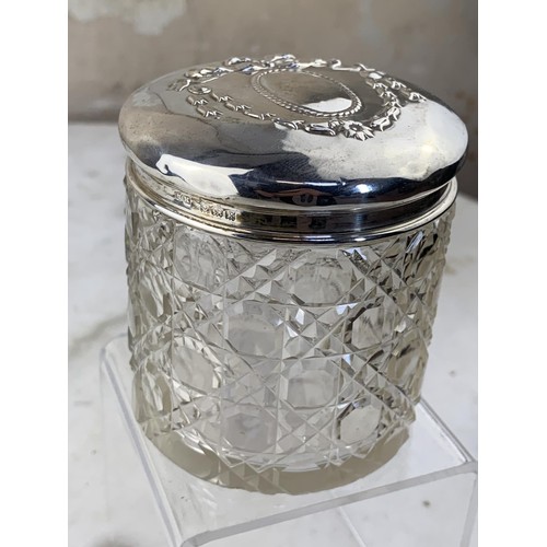 576 - A CUT GLASS SILVER TOPPED JAR (HENRY MATTHEWS BIRMINGHAM 1934)