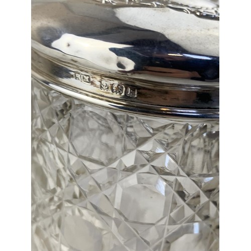 576 - A CUT GLASS SILVER TOPPED JAR (HENRY MATTHEWS BIRMINGHAM 1934)