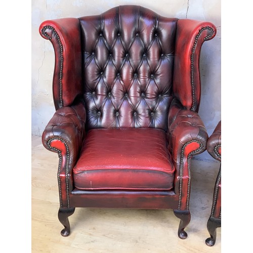 611 - PAIR OXBLOOD BUTTONED WINGBACK ARMCHAIRS