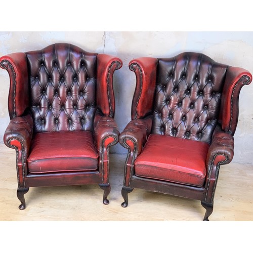 611 - PAIR OXBLOOD BUTTONED WINGBACK ARMCHAIRS