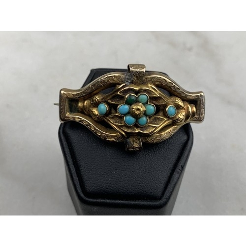 599 - AN 18CT GOLD BROOCH SET WITH TORQOUISE STONES