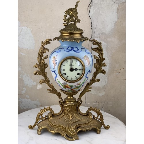 607 - A HEAVY BRASS HAND PAINTED CLOCK