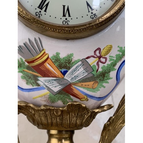 607 - A HEAVY BRASS HAND PAINTED CLOCK