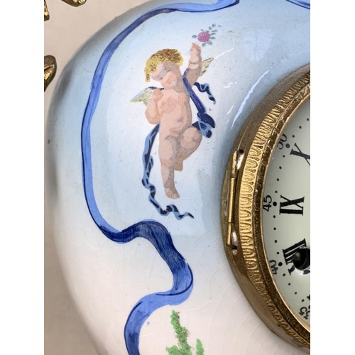 607 - A HEAVY BRASS HAND PAINTED CLOCK