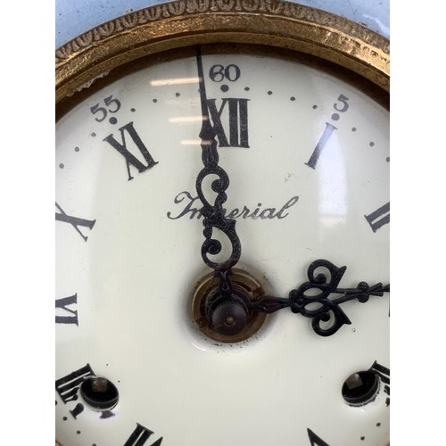 607 - A HEAVY BRASS HAND PAINTED CLOCK