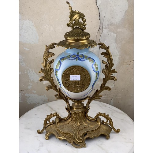 607 - A HEAVY BRASS HAND PAINTED CLOCK