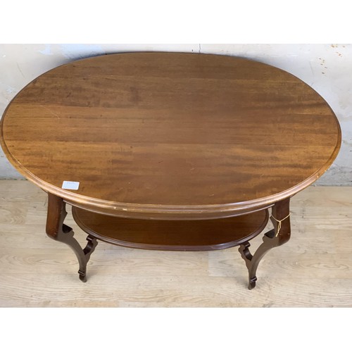 650 - SHAPED MAHOGANY SIDE TABLE WITH ORNATE LEG