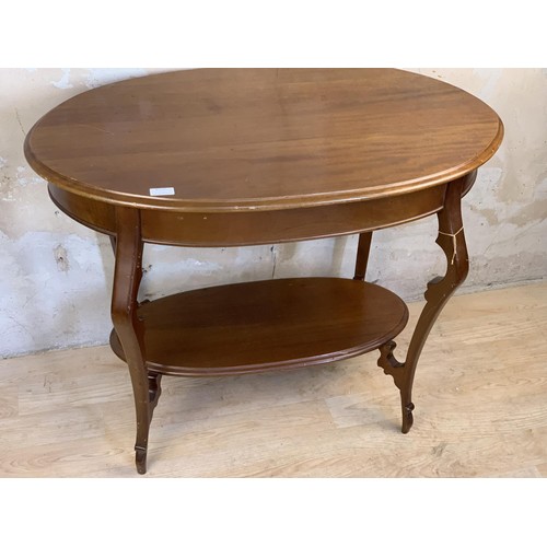 650 - SHAPED MAHOGANY SIDE TABLE WITH ORNATE LEG