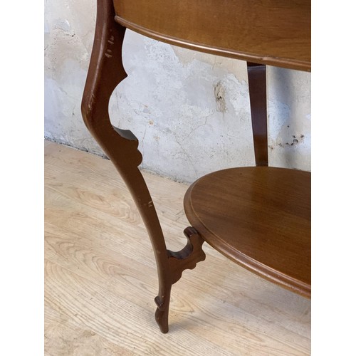 650 - SHAPED MAHOGANY SIDE TABLE WITH ORNATE LEG