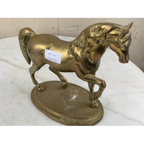 695 - A HEAVY BRASS HORSE FIGURE 9