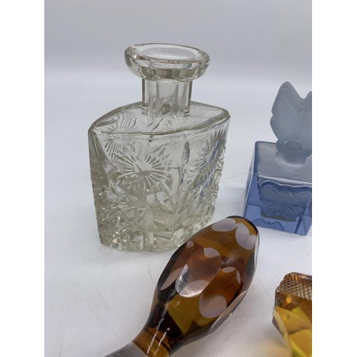 696 - 3 COLOURED GLASS DECANTER STOPPERS & 2 PERFUME BOTTLES