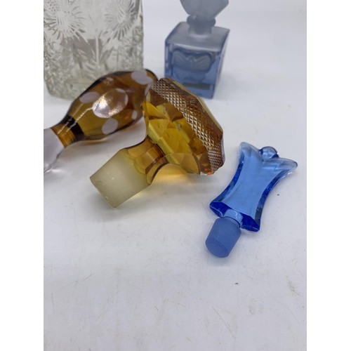 696 - 3 COLOURED GLASS DECANTER STOPPERS & 2 PERFUME BOTTLES