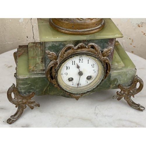 130 - A VICTORIAN GREEN MARBLE BASE CLOCK WITH SPELTER FIGURE 24