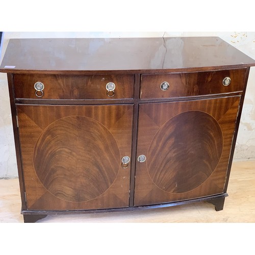 1 - A MAHOGANY 2 DOOR 2 DRAWER CUPBOARD