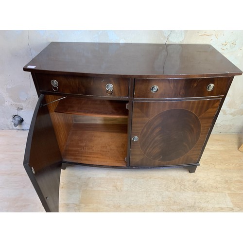 1 - A MAHOGANY 2 DOOR 2 DRAWER CUPBOARD