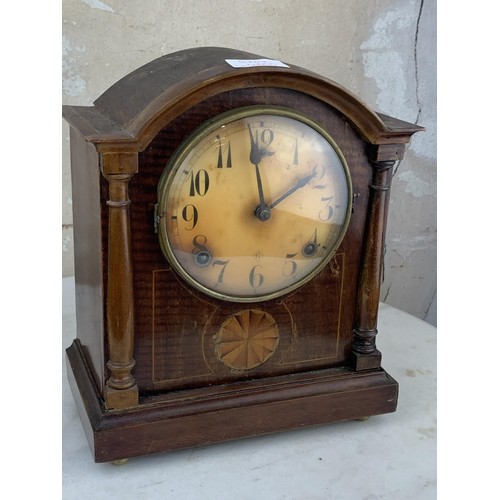 14 - AN INLAID MAHOGANY MANTLE CLOCK