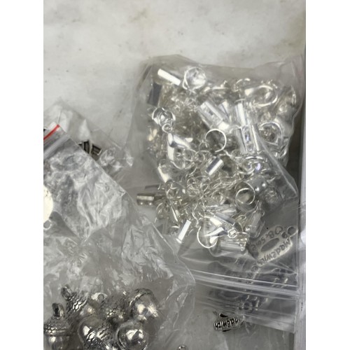 116 - A HARD CASE CONTAINING A LARGE AMOUNT OF WHITE METAL FOBS UNTESTED