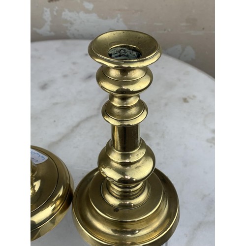 57 - 2 GRADUATED BRASS CANDLE STICKS TALLEST 10