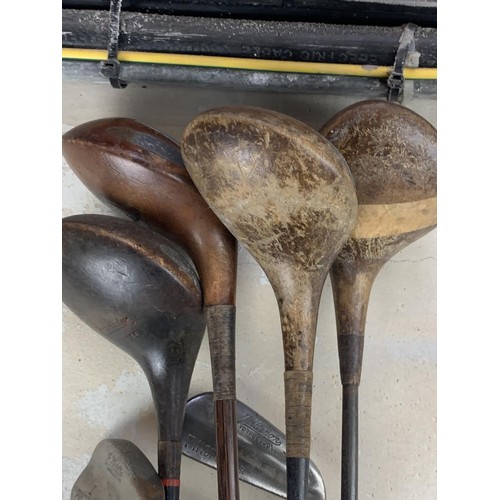 158 - ANTIQUE HICKORY GOLF CLUBS IN A LEATHER BAG