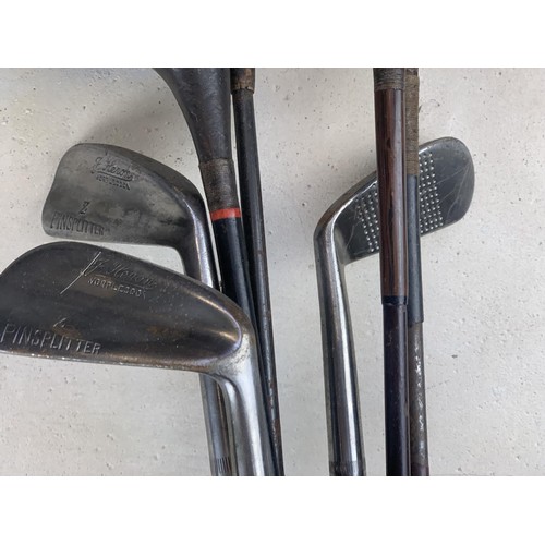 158 - ANTIQUE HICKORY GOLF CLUBS IN A LEATHER BAG