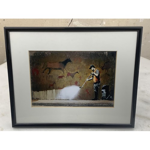 178 - AN EBONY FRAMED BANKSY PRINT 10 X 8