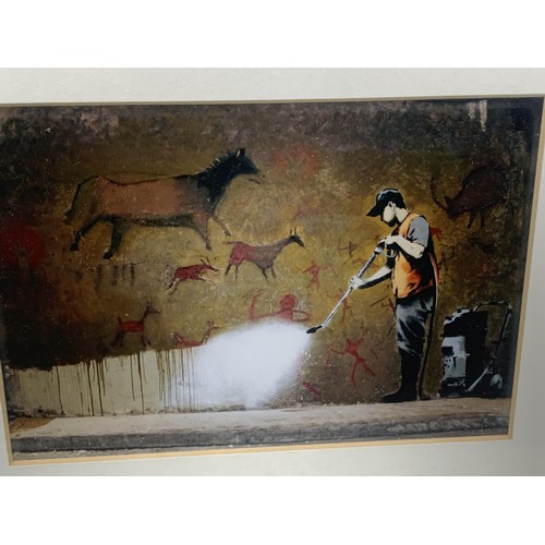 178 - AN EBONY FRAMED BANKSY PRINT 10 X 8