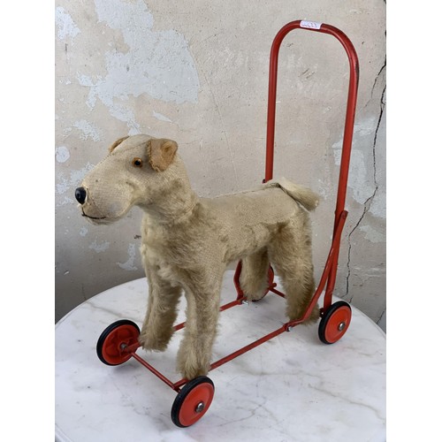 179 - AN ANTIQUE TRIANG PUSH ALONG FOX TERRIER