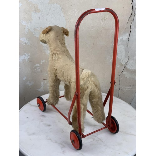 179 - AN ANTIQUE TRIANG PUSH ALONG FOX TERRIER