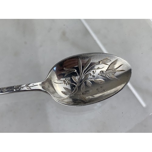 259 - A SHEFFIELD SILVER TEASPOON WITH  FLORAL AND SWALLOW EMOBSSED