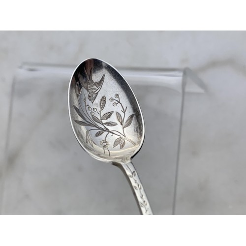 259 - A SHEFFIELD SILVER TEASPOON WITH  FLORAL AND SWALLOW EMOBSSED