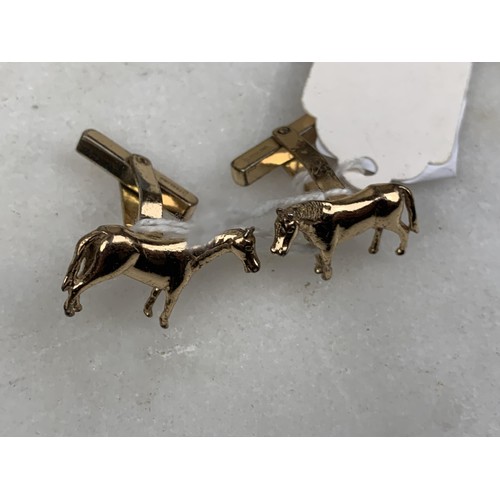 261 - A PAIR OF SILVER GILT HORSE CUFFLINKS