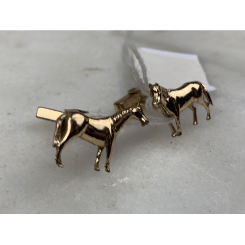 261 - A PAIR OF SILVER GILT HORSE CUFFLINKS