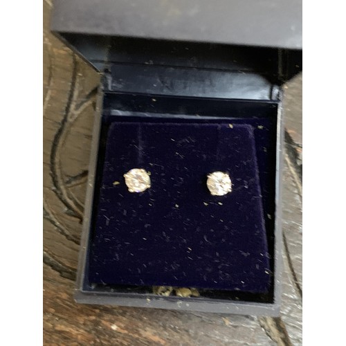 296 - A PAIR OF SILVER SOLITAIRE EARRINGS