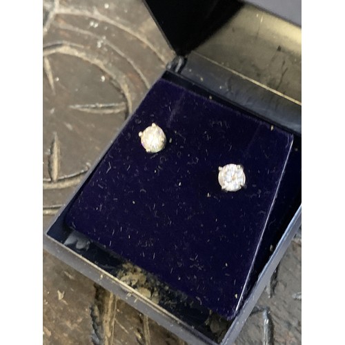 296 - A PAIR OF SILVER SOLITAIRE EARRINGS