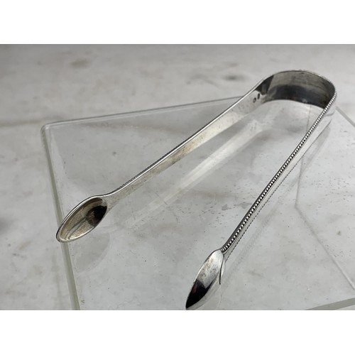 301 - A PAIR OF SILVER SUGAR TONGS 34.4grms