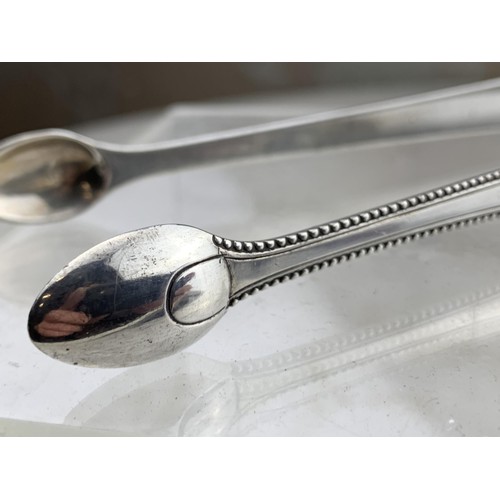 301 - A PAIR OF SILVER SUGAR TONGS 34.4grms