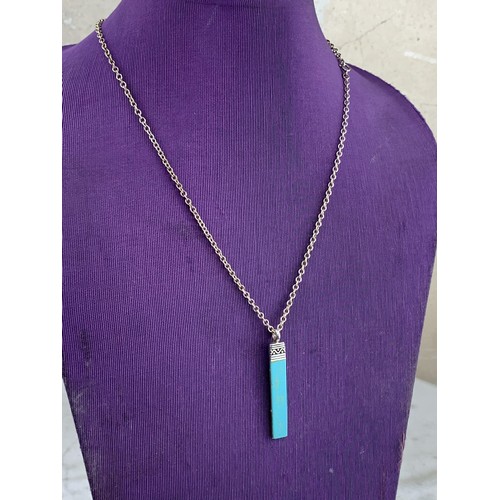 302 - A SILVER AND TURQUOISE BAR PENDANT ON SILVER CHAIN