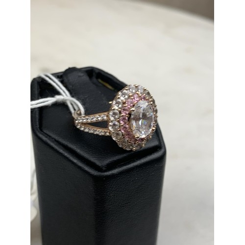 310 - A PINK SAPPHIRE AND CZ SILVER RING