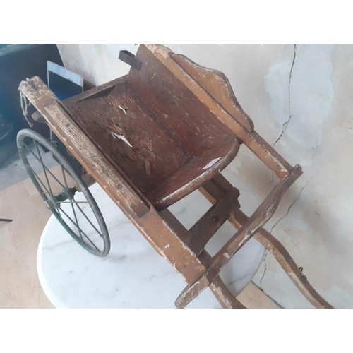 358 - A VINTAGE HANDMADE MODEL CART WITH METAL WHEELS