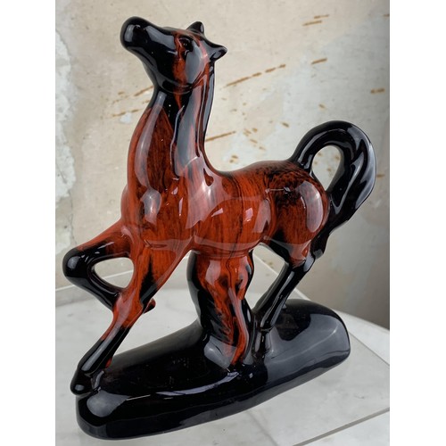 379 - A GLAZED TERRACOTTA HORSE 8