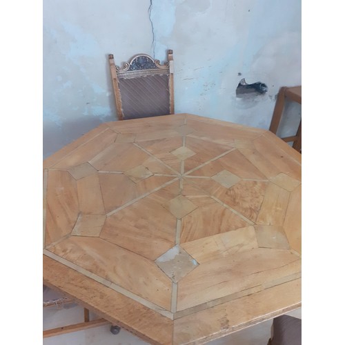 382 - A HEXAGONAL INLAID INDIAN WOOD TABLE WITH HEAVILY CARVED BACKED CHAIRS