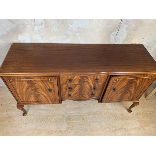 385 - A 3 DRAWERED 2 DOOR FLAME MAHOGANY SIDEBOARD