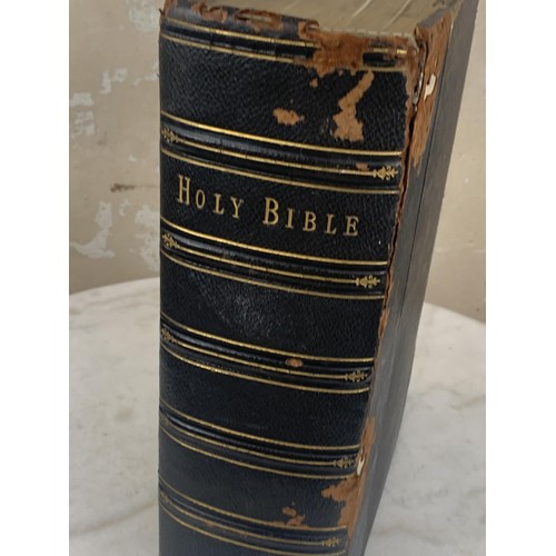 387 - A LARGE ANTIQUE LEATHER BOUND BIBLE