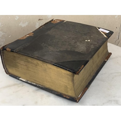 387 - A LARGE ANTIQUE LEATHER BOUND BIBLE