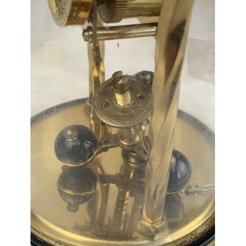 388 - A BRASS GERMAN WORKS ANNIVERSARY CLOCK UNDER GLASS DOME