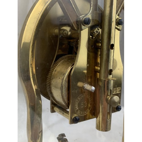 388 - A BRASS GERMAN WORKS ANNIVERSARY CLOCK UNDER GLASS DOME