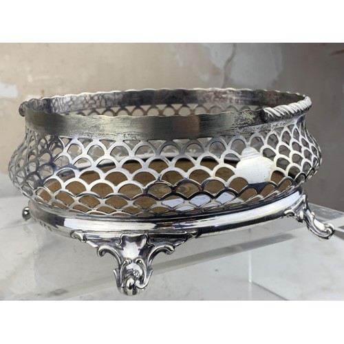 397 - PIERCED WHITE METAL BASKET ON POD QUAD FOOT