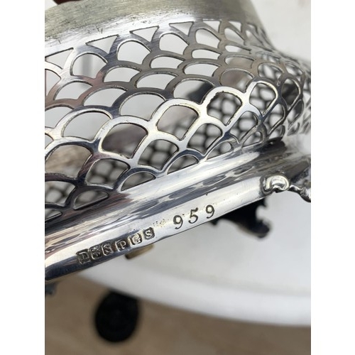 397 - PIERCED WHITE METAL BASKET ON POD QUAD FOOT