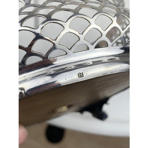 397 - PIERCED WHITE METAL BASKET ON POD QUAD FOOT